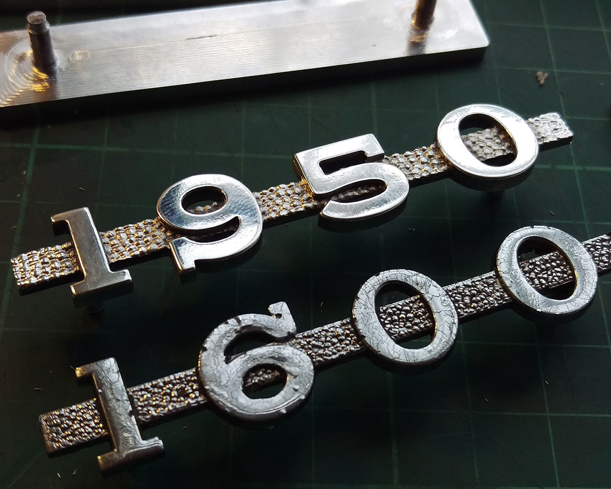 A set of three 1950 custom badges made for an MGA after an engine upgrade.