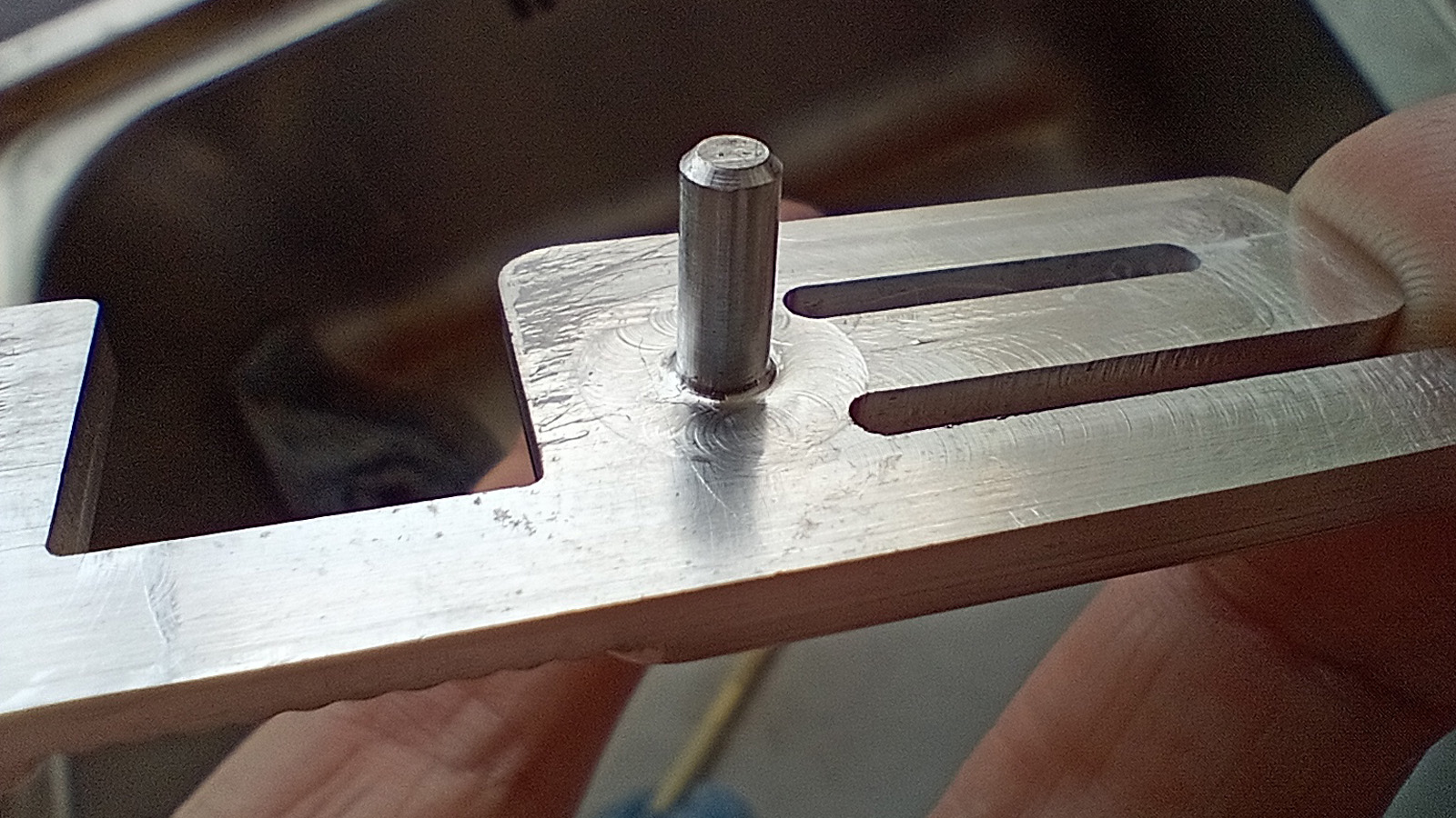 Machined from billet with mounting spigots to the rear.