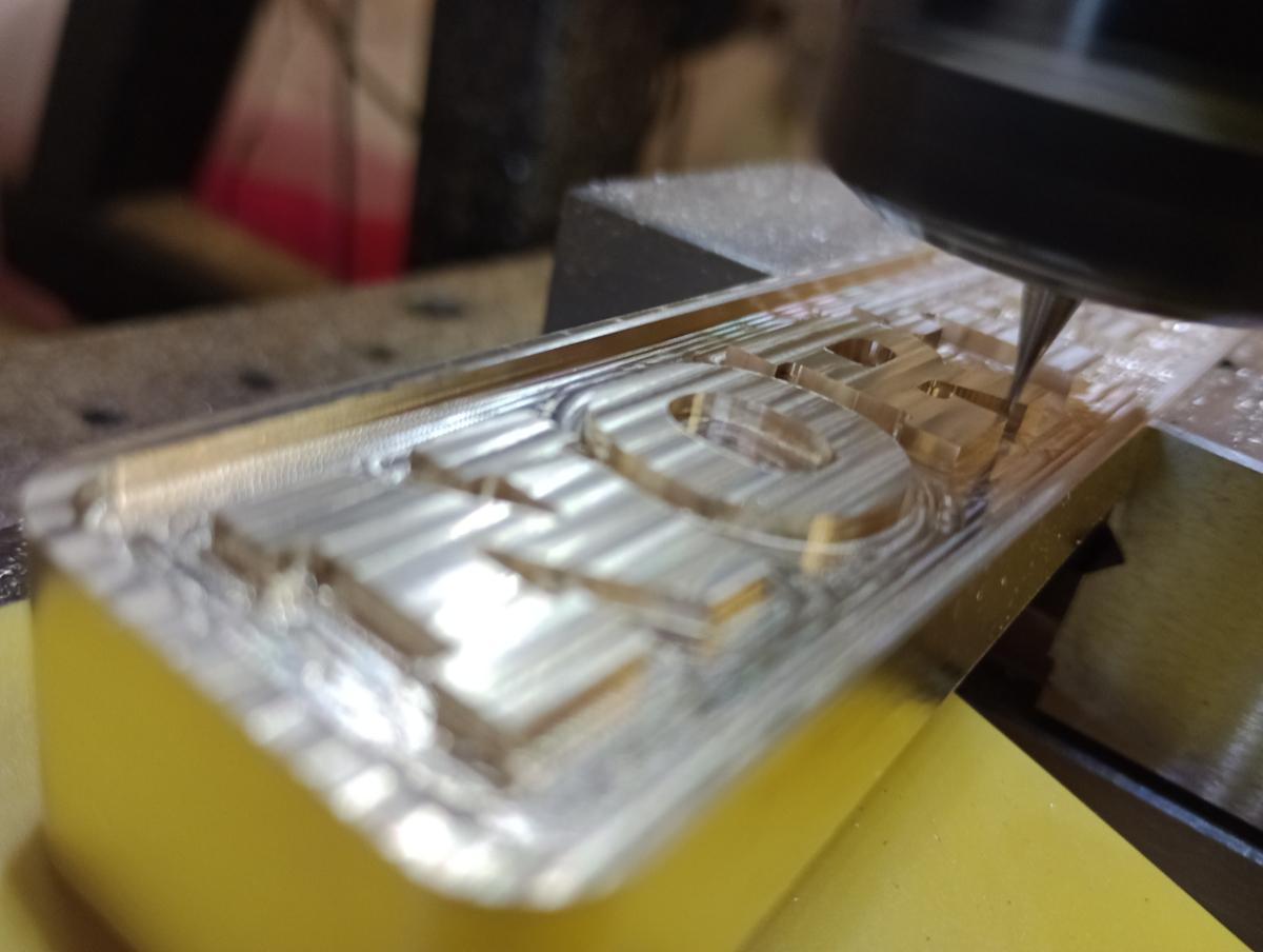 A couple of shots of the work in progress - there were a few twists and turns - let's just say that brushed surfaces aren't all that compatible with resin domes.  🙄
